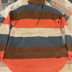 Carve Designs Turtleneck Sweater in coral , Blue, Brown, and Cream